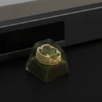 Multiple views of the handcrafted resin Colosseum artisan keycap, revealing its intricate miniature Roman ruins and sculptural details, evoking ancient design.