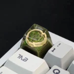 Handcrafted resin Colosseum artisan keycap, intricate miniature ancient Roman ruins. Sculptural detail and historical grandeur from various angles.