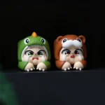 Displaying different angles of the Crying Baby artisan resin keycap, a handcrafted whimsical character with tearful expression. Unique keyboard art.