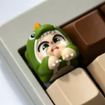 Handcrafted Crying Baby artisan resin keycap, showcasing its unique whimsical character and tearful expression from various artistic angles.
