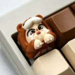 Multiple handcrafted Crying Baby Artisan Resin Keycaps displayed from various angles, highlighting their adorable whimsical designs.