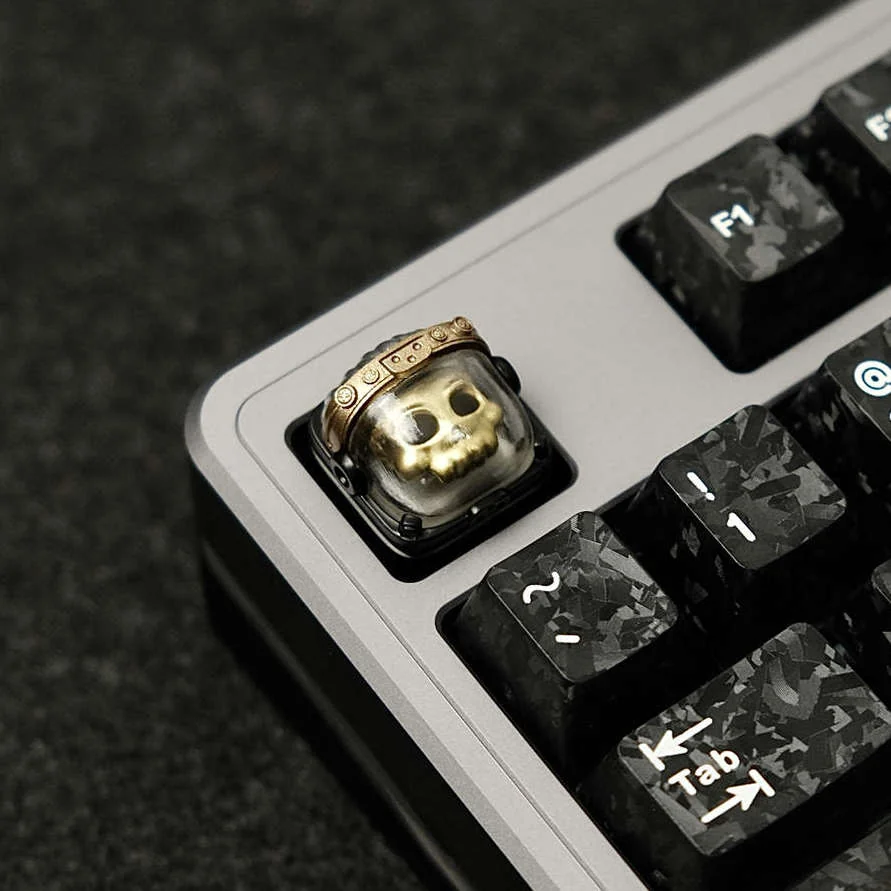 Close-up of a handcrafted artisan astronaut keycap, showcasing the intricately detailed tactical space warrior glowing within backlit resin.
