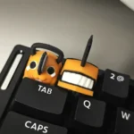 Close-up of the handcrafted Denji Chainsaw Man collectible keycap, showcasing its vibrant 3D printed details and artistic design from a dynamic angle.