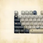 An artistic close-up of the Emily Dickinson Keycaps set, showcasing delicate vintage designs, muted tones, and subtle golden accents, embodying the poetic design.