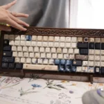 Close-up of the exclusive Emily Dickinson Keycaps set: Poetic Enclosed Garden Set, featuring vintage-inspired keycaps with muted tones and subtle design.