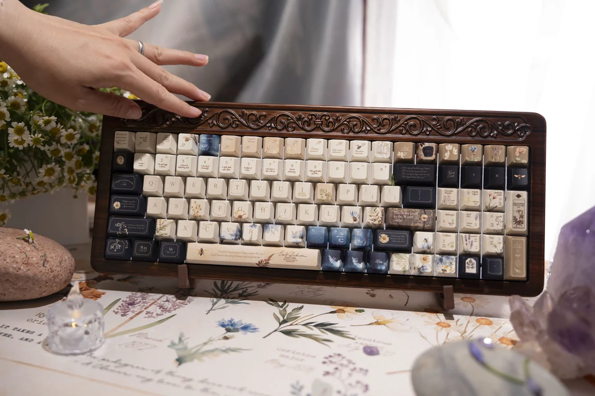 Close-up of the exclusive Emily Dickinson Keycaps set: Poetic Enclosed Garden Set, featuring vintage-inspired keycaps with muted tones and subtle design.