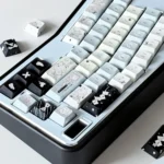 Fake Angel PBT dye-sub keycaps set. Unique, whimsical angelic designs with a rebellious twist. Artistic soft, striking colors from multiple angles.