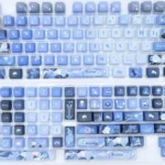 Exclusive Furina keycaps from the Genshin Impact Furina 2.0 PBT set, beautifully displayed with elegant character art and vibrant aquatic motifs.