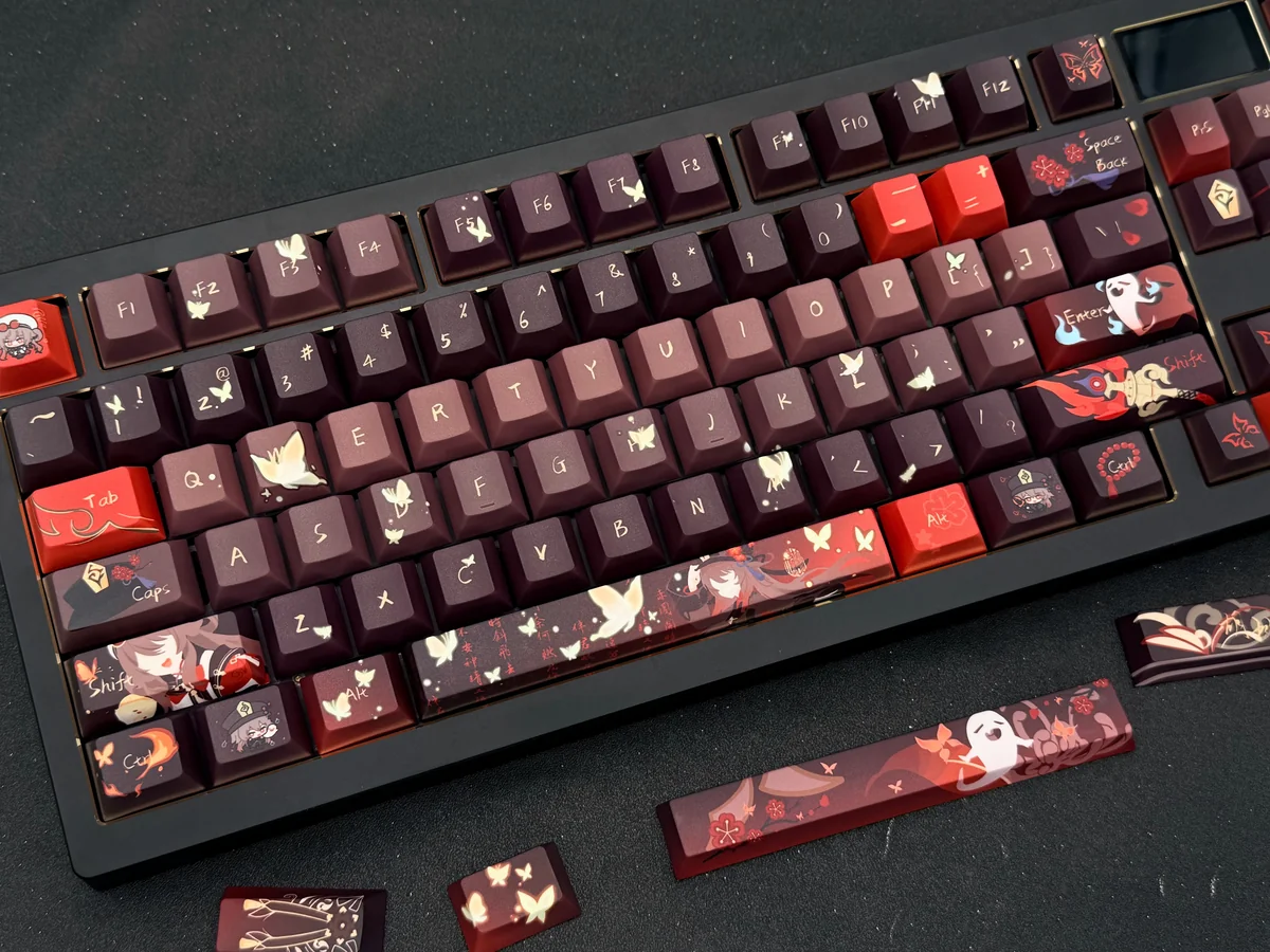 Exclusive Genshin Impact Hu Tao artisan keycaps, showcasing vibrant character art and her iconic ghost companions from multiple angles.