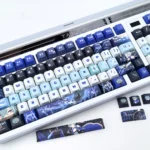 Multiple views of the exclusive Genshin Impact Lohen PBT side-engraved keycap, showcasing its mystical character art and premium texture from various angles.
