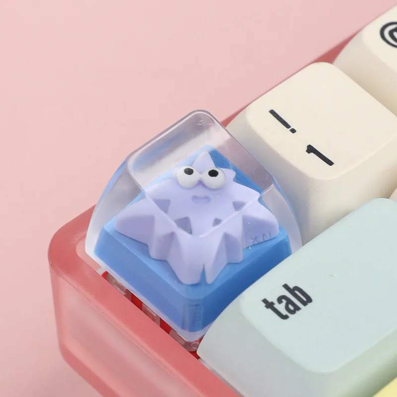 A collection of playful geometric monster keycaps for custom keyboards, showcasing unique artisan ESC designs from various angles, adding vibrant perspective.