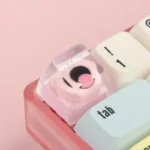 A vibrant gallery of geometric monster keycaps for custom keyboards, showcasing playful artisan ESC designs from various angles, adding unique personality design.