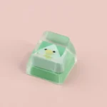 Vibrant geometric monster keycaps displayed from multiple angles, showcasing unique, playful artisan designs for custom keyboards, adding whimsical angle.