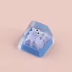 Whimsical Geometric Monster Keycap,variant, featuring a vibrant, abstract design with a large eye and star-like elements for unique design.