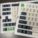 Various angles of durable PBT GMK Coniferous R2 keycaps, highlighting the artistic East Asian landscape design and calming earthy tones.