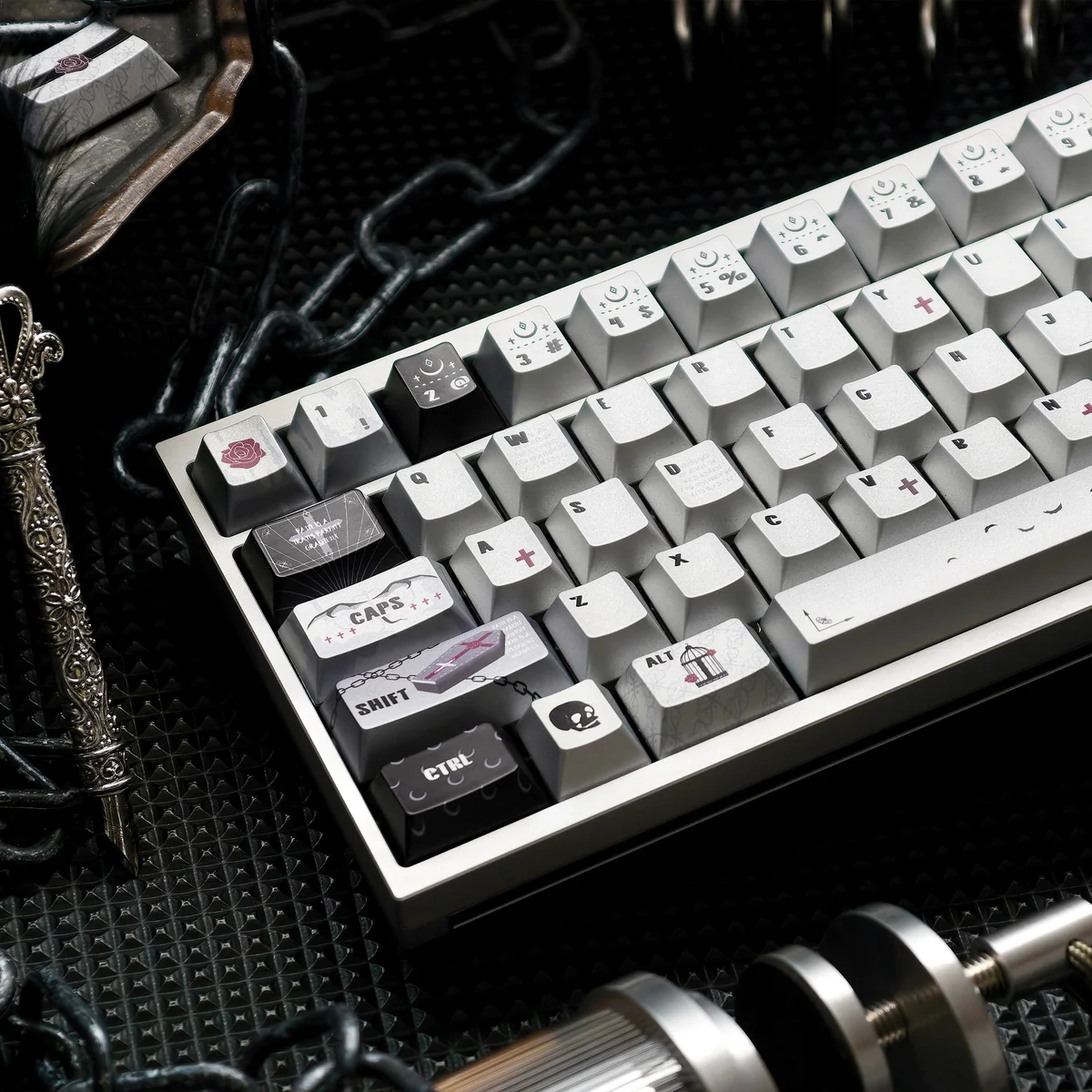 An artistic angle of the PBT Dye-Sub Gothic Style Prayer Keycaps, revealing intricate ancient spiritual iconography and a unique metallic sheen