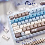 Detailed view of the 145-key Gourmet Sea Salt Keycaps Set. Premium PBT dye-sub keys feature warm browns, creamy whites, and grey, evoking gourmet chocolate.