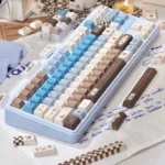 Gourmet Sea Salt PBT Dye-Sub 145 keycaps. Multiple angles show warm browns, creamy whites, subtle grey, evoking premium chocolate.