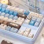 Gourmet Sea Salt PBT Dye-Sub 145-keycaps in warm browns, creamy whites, subtle grey. Multiple angles showcase gourmet chocolate aesthetic.