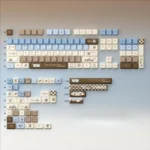 A close-up view of the Gourmet Sea Salt PBT dye-sub keycaps, highlighting their warm brown, creamy white, and subtle grey gourmet chocolate aesthetic.