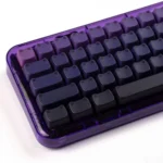 Artistic close-up of a luminous gradient cat ear keycap set, highlighting its vibrant color shift and charming cat ear design with crisp side legends.