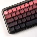 Luminous gradient cat ear keycap set, showcasing artistic side-engraved legends for a vibrant and playful desktop setup.