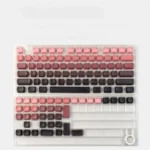 A collection of vibrant luminous gradient cat ear keycaps set, showcasing their playful design and glowing side legends from various artistic angles.