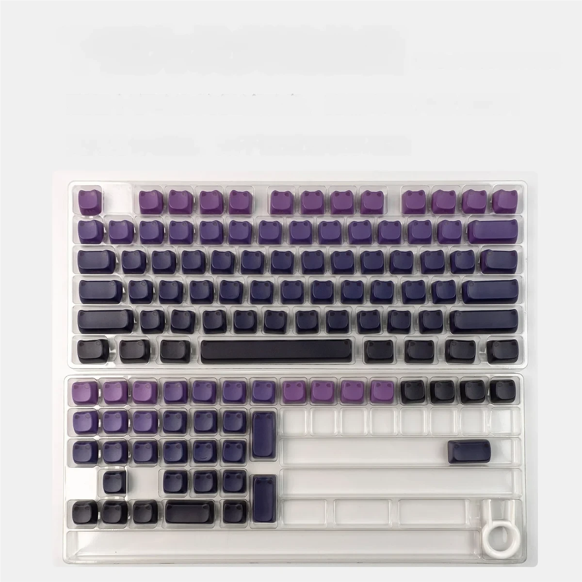 A vibrant pink-blue gradient luminous cat ear keycap set with side-engraved legends, adding an artistic and playful touch to any desktop.