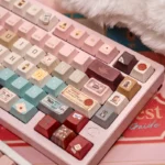 Grand Budapest PBT keycaps set, showcasing the exclusive pastel art deco design and whimsical Wes Anderson aesthetic, perfect for a vintage keyboard.