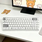 Exclusive Gray Rilakkuma PBT MOA keycap set, showcasing beloved characters in a sophisticated, minimalist palette. This artistic collection elev