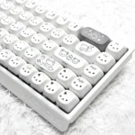 Exclusive Gray Rilakkuma PBT MOA keycaps displayed from a top-down view, highlighting the beloved characters and sophisticated minimalist design.