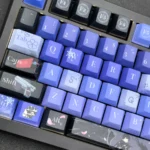 Close-up of a handcrafted Gu Shiye keycap, showcasing its intricate, fantastical character design and ethereal artistry from a unique angle.