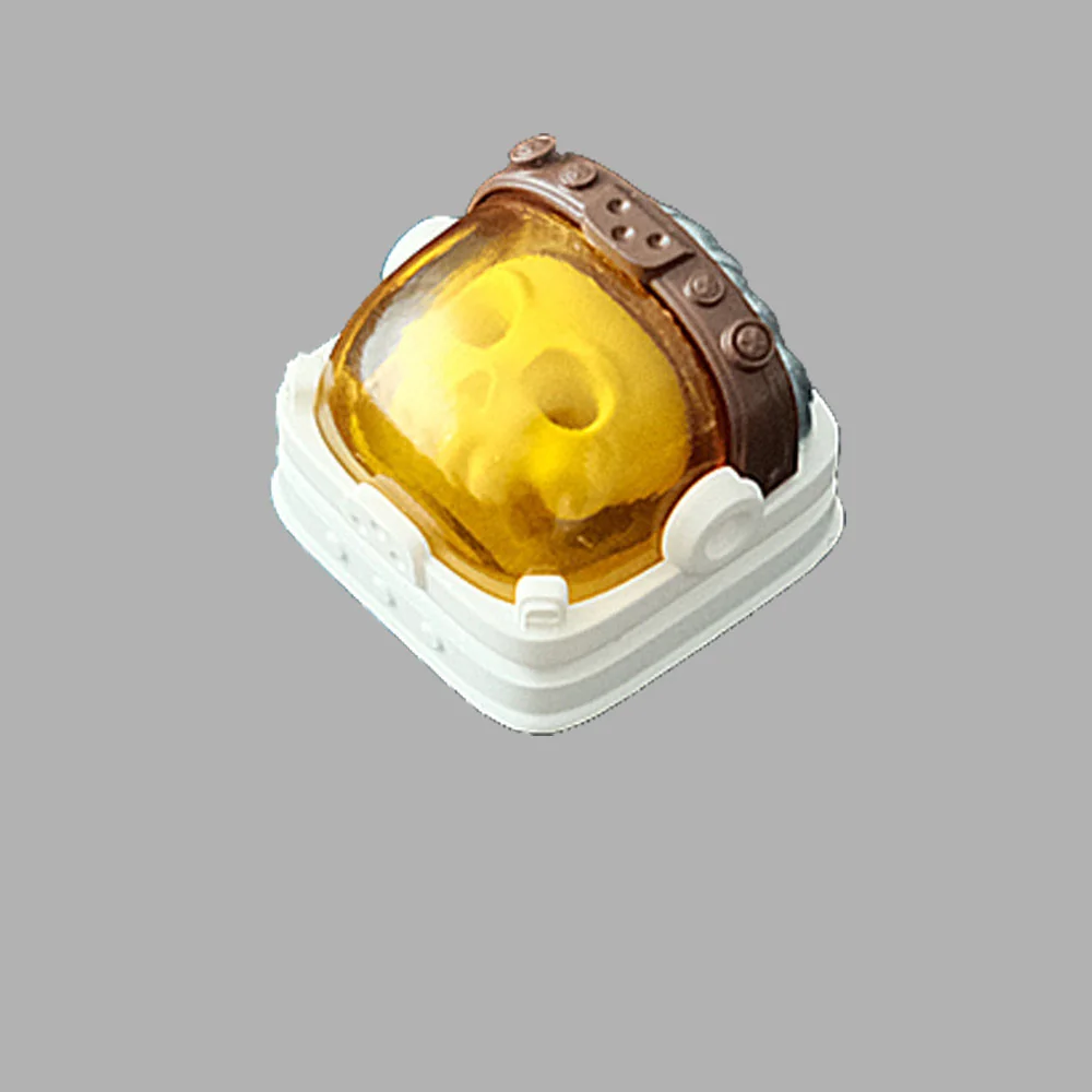 Handcrafted resin astronaut backlit keycap. Unique angle highlights the intricate astronaut figure suspended in translucent resin.