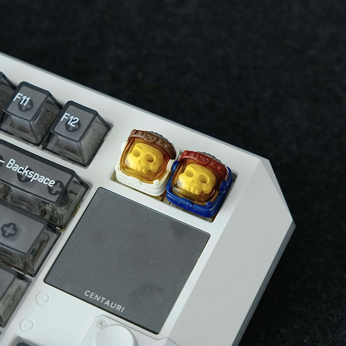 Handcrafted resin astronaut backlit keycap showcasing a detailed astronaut figure encased in translucent resin, evoking cosmic space art.