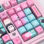 Multiple angles of the exclusive Hisoka and Illumi Zoldyck PBT MDA keycap set, showcasing its dark, mysterious Hunter x Hunter motifs and premium craftsmanship.