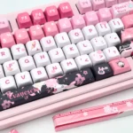 Exclusive Honkai Star Rail Evanescia PBT keycaps set, featuring mystical crimson and indigo designs, showcased from a unique angle, highlighting the elegant mystical crimson and indigo palette.