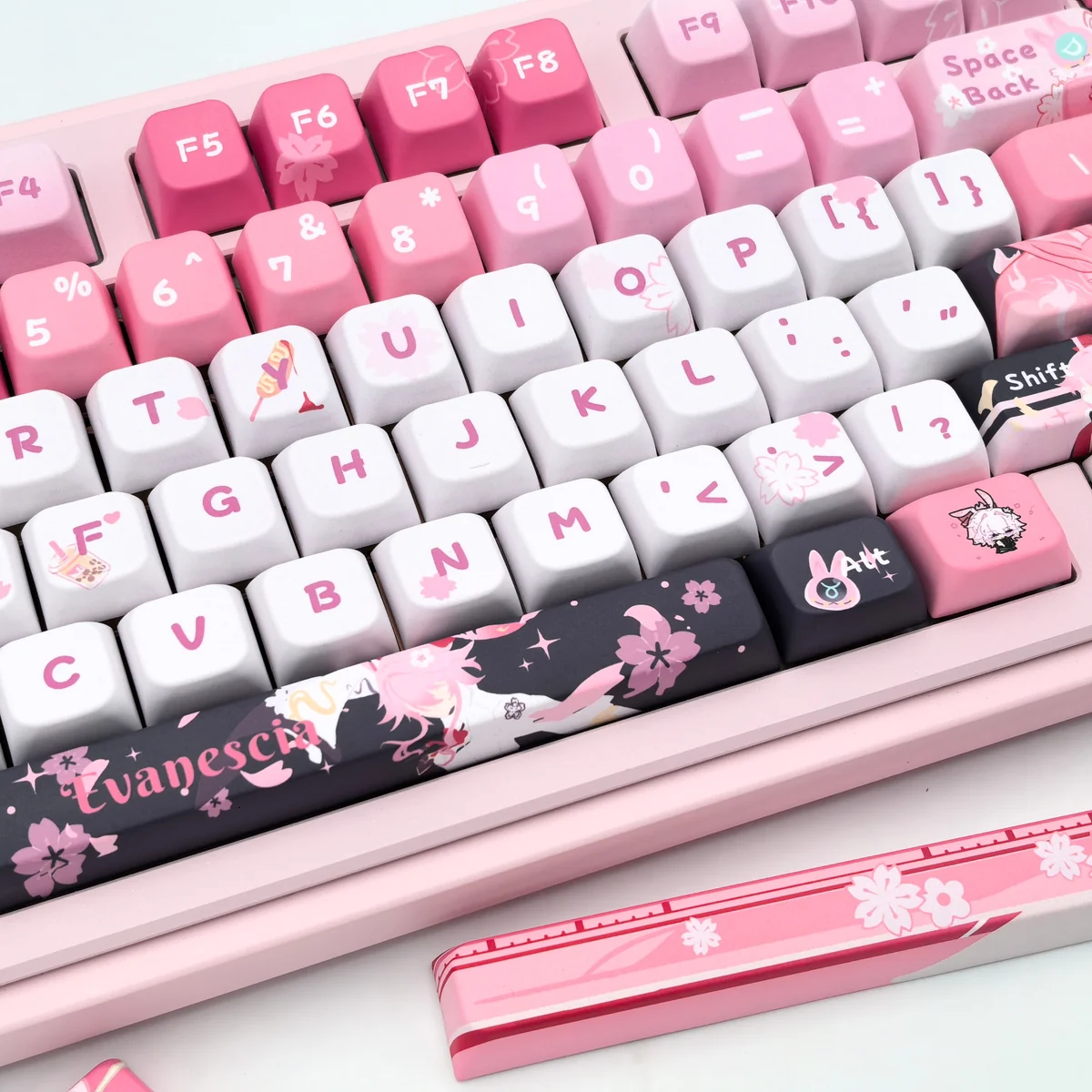 Exclusive Honkai Star Rail Evanescia PBT keycaps set, featuring mystical crimson and indigo designs, showcased from a unique angle, highlighting the elegant mystical crimson and indigo palette.