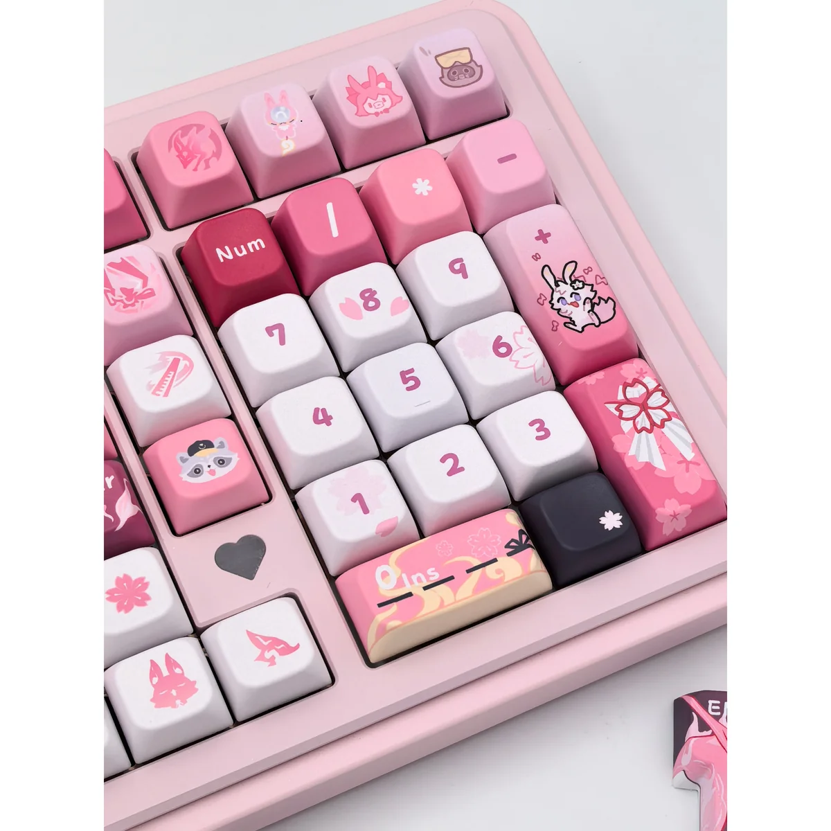 Exclusive Honkai Star Rail Evanescia PBT keycaps set. Detailed view of mystical crimson and indigo hues, elegant character design, and premium PBT material.