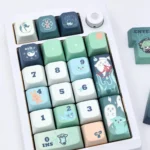 Artistic product gallery of the exclusive Huohuo Keycap Set, highlighting its whimsical Honkai Star Rail spectral charm and vibrant anime Huohuo art.