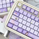 IU Lee Ji-eun keycap set close-up, showcasing exclusive PBT material's serene elegance. Artistic detail highlights dreamy aesthetic and sophisticated legends.