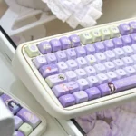 A detailed view of the IU Lee Ji-eun Keycap Set, highlighting the serene elegance and sophisticated PBT texture from a unique angle, embodying exclusive IU-inspired.