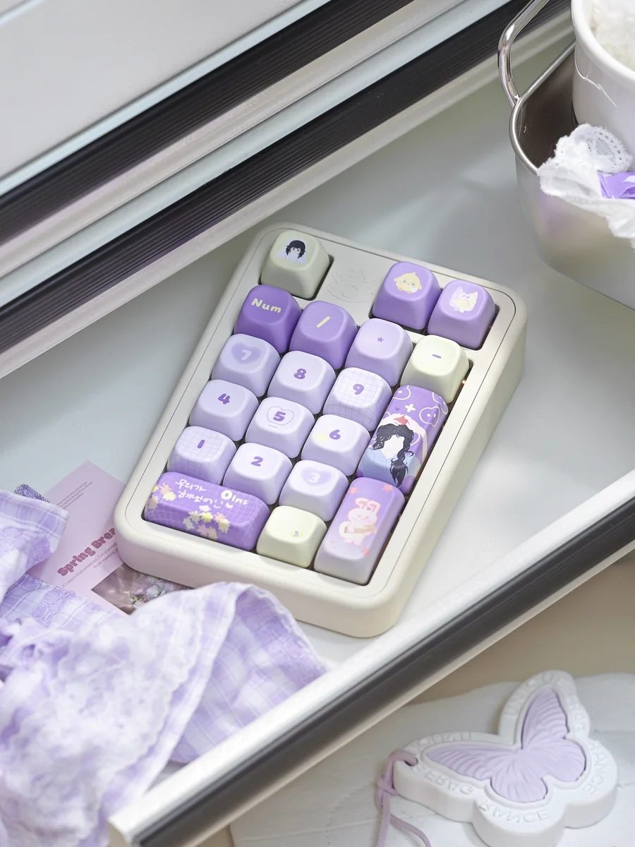 Explore the exclusive IU Lee Ji-eun keycap set from different angles, highlighting the dreamy, sophisticated PBT keyboard art and serene elegance inspired by IU.