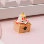 Handcrafted Kagami Mochi keycap close-up, revealing its unique stacked mochi design and symbolic orange details from various artistic angles.