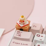 Handcrafted Kagami Mochi keycap, a unique artisan piece featuring traditional stacked mochi and a symbolic orange, perfect for festive keyboards.