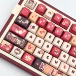 Genshin Impact Klee's Explosive Charm MDA keycaps set. Exclusive vibrant red and orange Klee character motifs, playfully displayed from all angles.