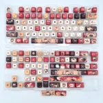 Klee Genshin Impact MDA keycaps, vibrant red and orange with explosive character designs. Playful artistic details seen from multiple angles.