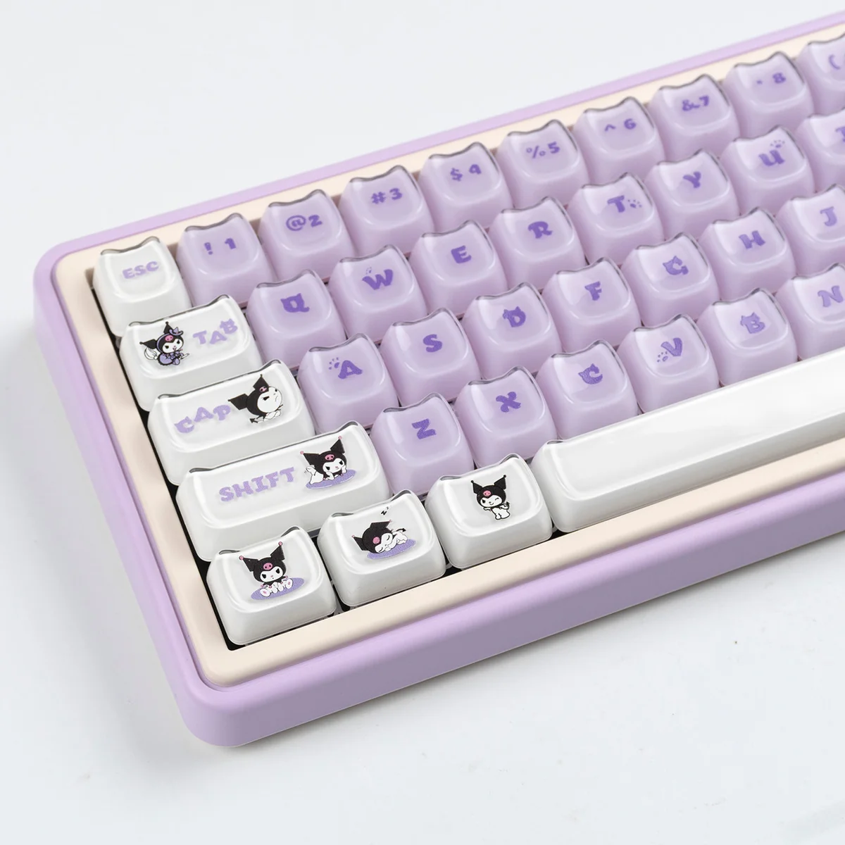 Crystal jelly Kuromi keycap set, showing its mischievous RGB glow from various angles for your keyboard.