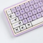 A playful, jelly Kuromi keycap set for magnetic switches, captured from a unique angle, highlighting its design and vibrant RGB design.