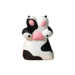 Close-up views of the whimsical dog paw artisan keycap, showcasing its adorable handcrafted resin design from multiple angles with vibrant colors。