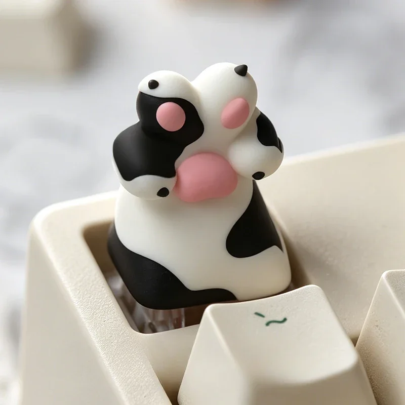 Adorable resin Dog Paw Keycap, handcrafted with vibrant colors, perfectly capturing a whimsical pet lover's charm.